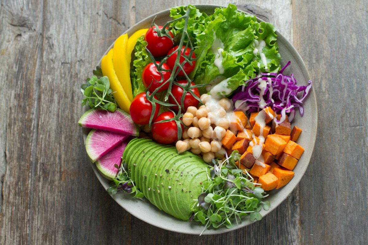 Plant-forward plate with vegetables, legumes, and whole grains for constipation diet