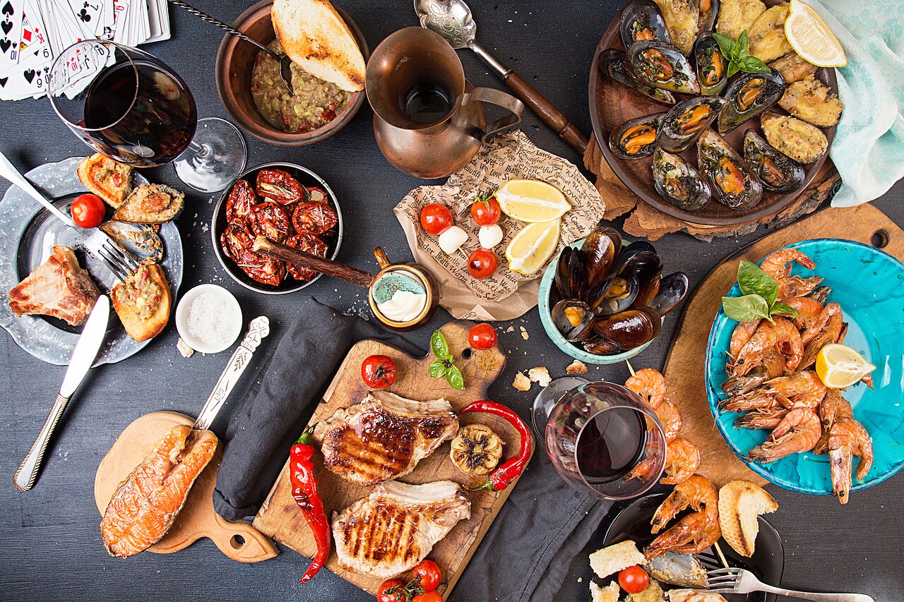 Seafood dinner spread with fish, a natural vitamin D source often suggested for bone health