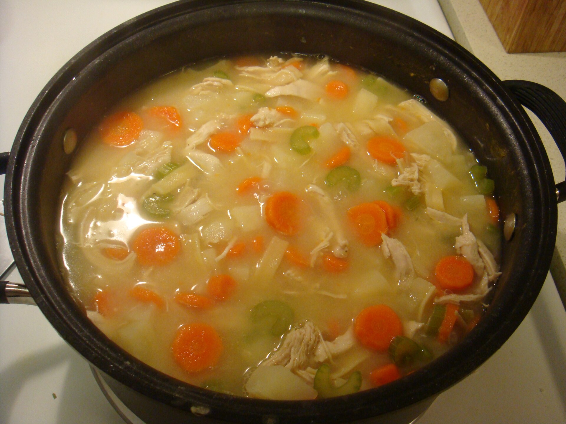 Bowl of chicken noodle soup — supportive meal idea during fever recovery, not a plague cure