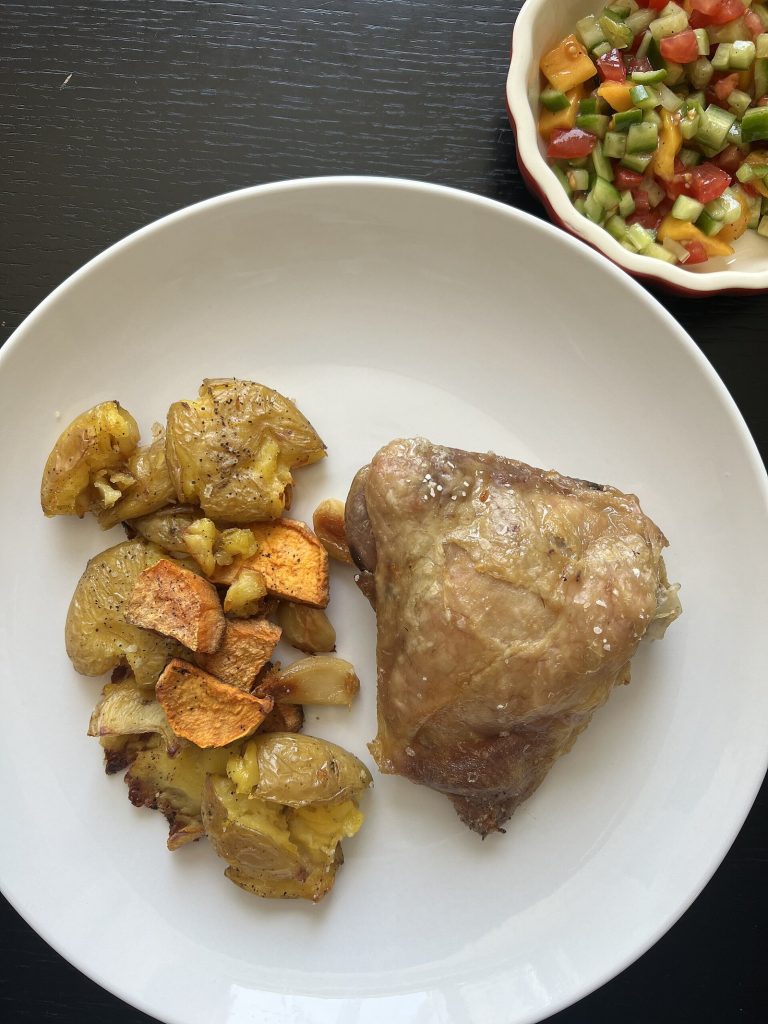 Grilled chicken with potatoes and salad as a protein-forward meal during ACL rehab