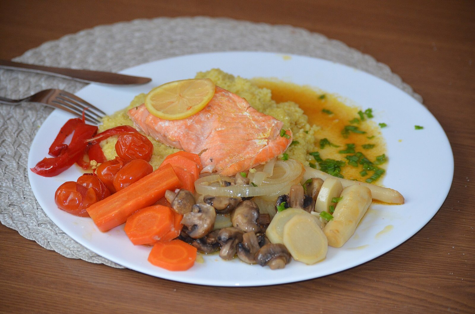 Small plate of baked salmon with vegetables as a protein-first meal after bariatric surgery