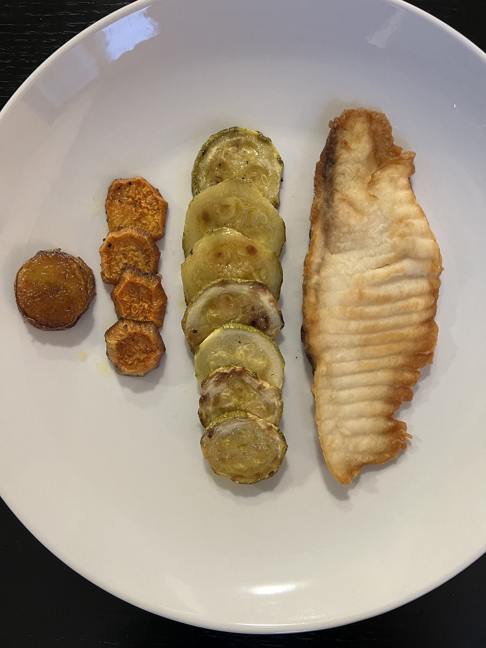 Baked tilapia with roasted zucchini and sweet potato illustrating recovery dinners after spinal fusion