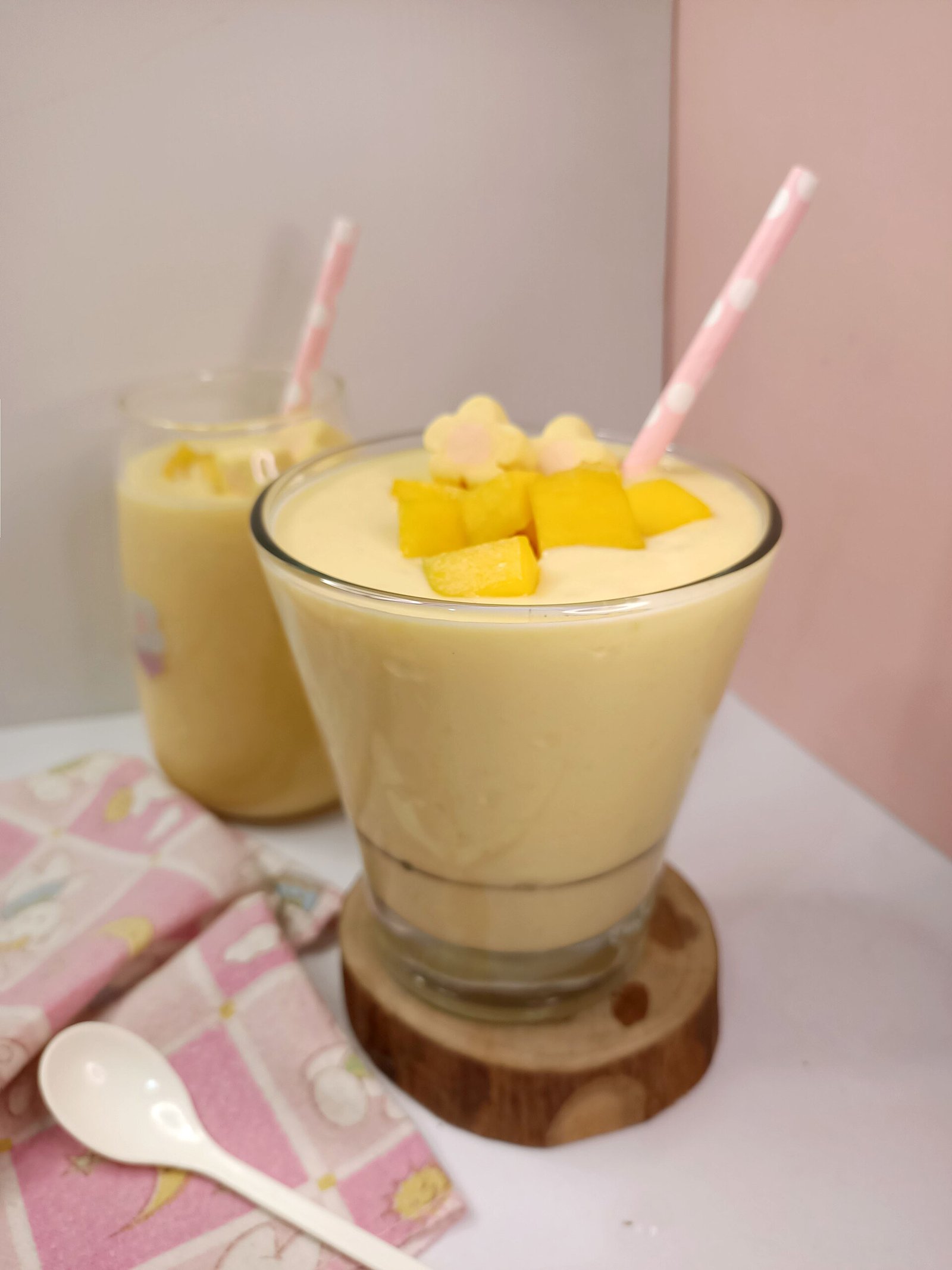 Mango banana smoothie bowl eaten with a spoon during wisdom teeth recovery