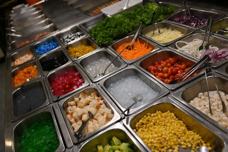 Colorful vegetable salad bar ingredients reflecting DASH-style eating often discussed for PKD blood pressure support