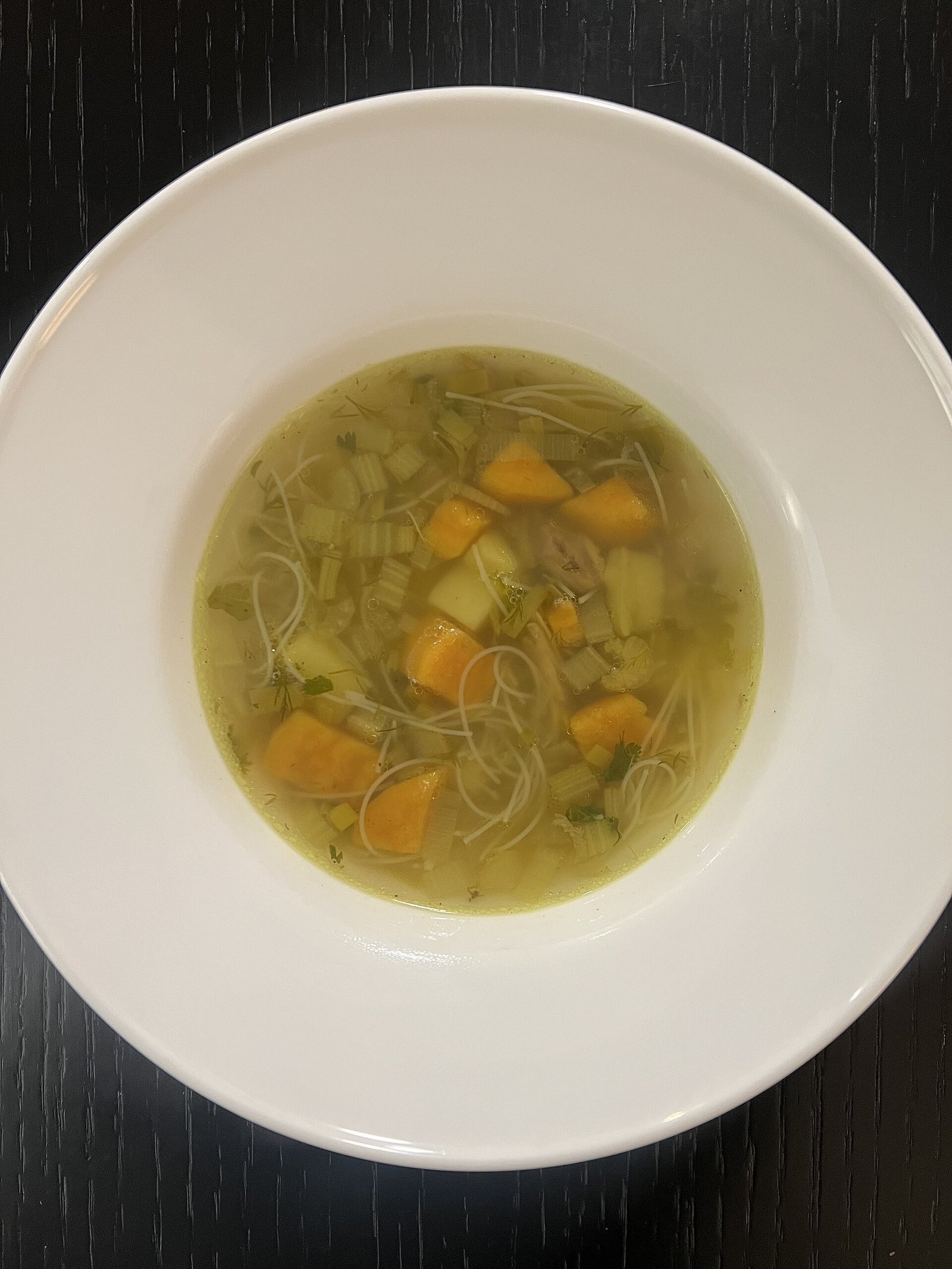 Chicken soup with rice noodles illustrating gentle warm fluids during sinus surgery recovery