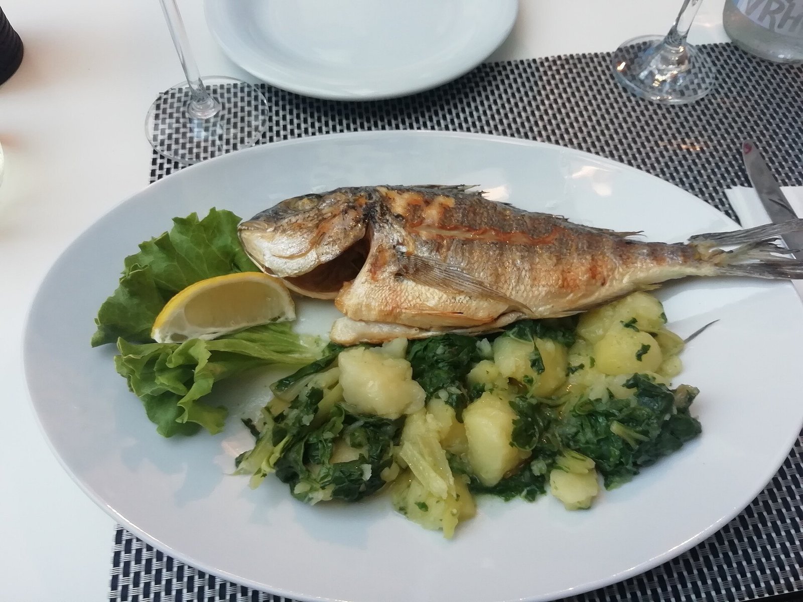 Grilled fish with vegetables and lemon as a lower-fat BAM-friendly dinner