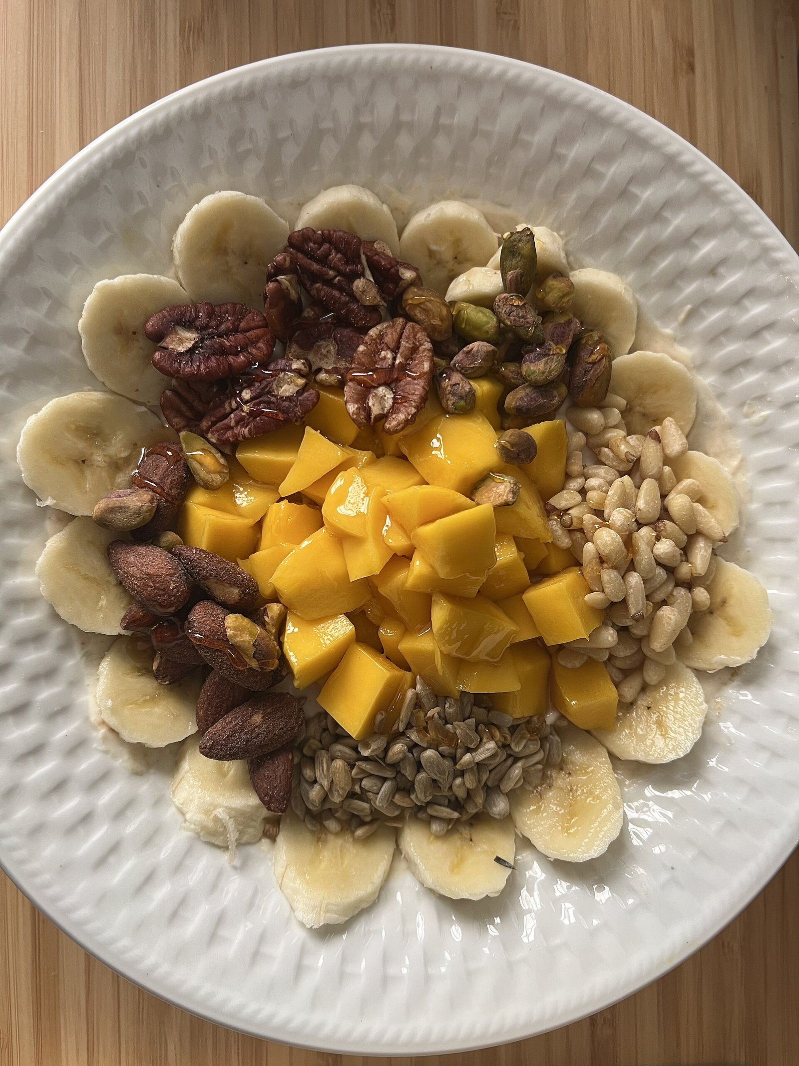 Fruit bowl supporting fluid-rich snacks beside water