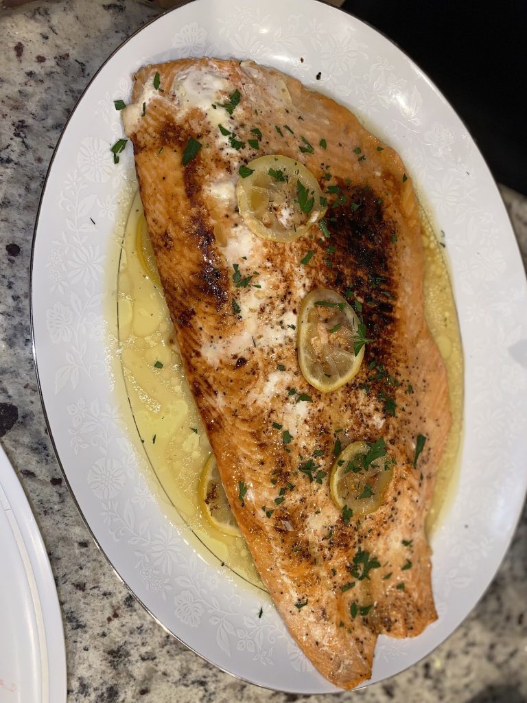 Baked salmon fillet with lemon, an omega-3 rich fatty fish for a depression diet
