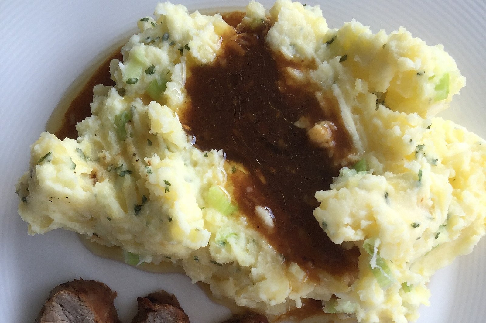 Mashed potato with gravy as a moist soft dinner side