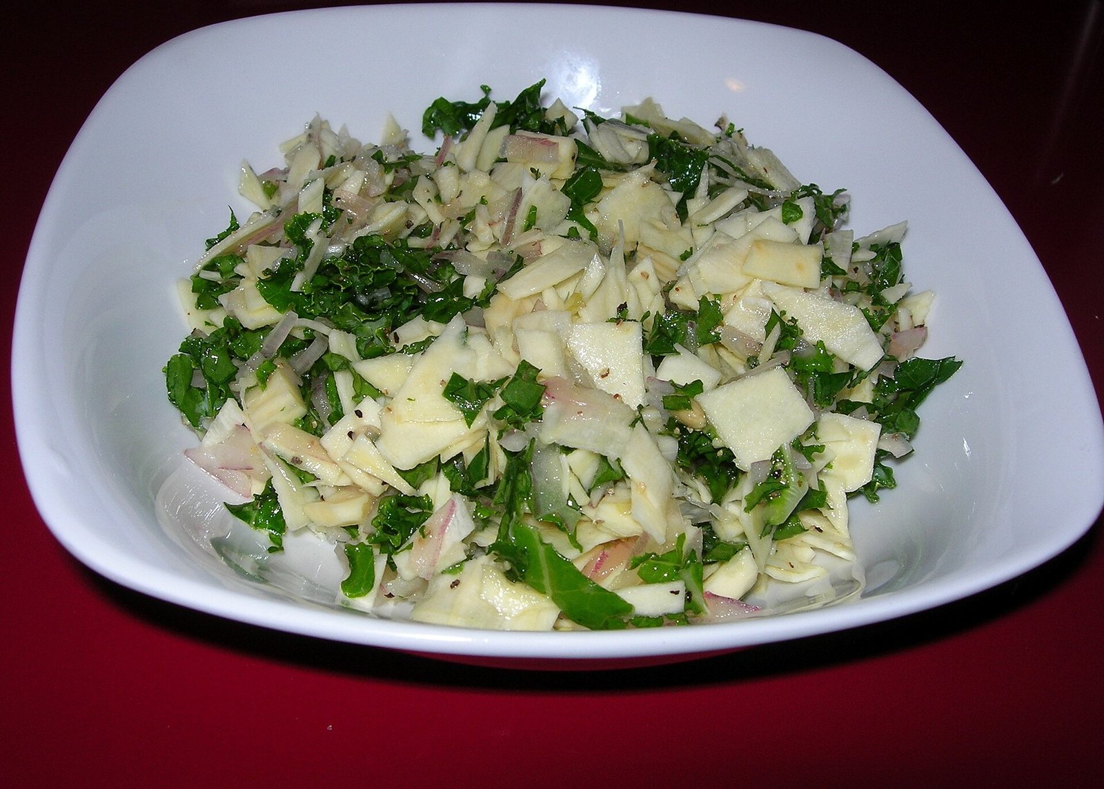 Kale salad with parsnips and red onion for lutein-rich produce habits