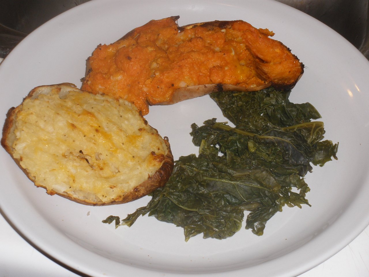 Baked potato with sweet potato and steamed kale for a fiber-rich recovery plate