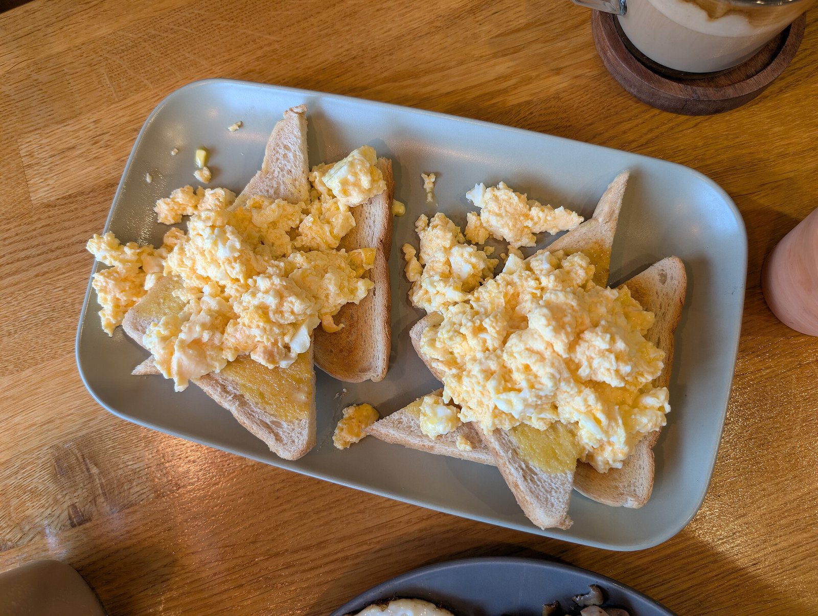 Scrambled eggs on toast cut into small bites for jaw comfort