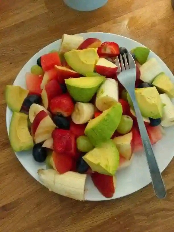 Fruit salad with avocado as a sweet option without salty packaged desserts