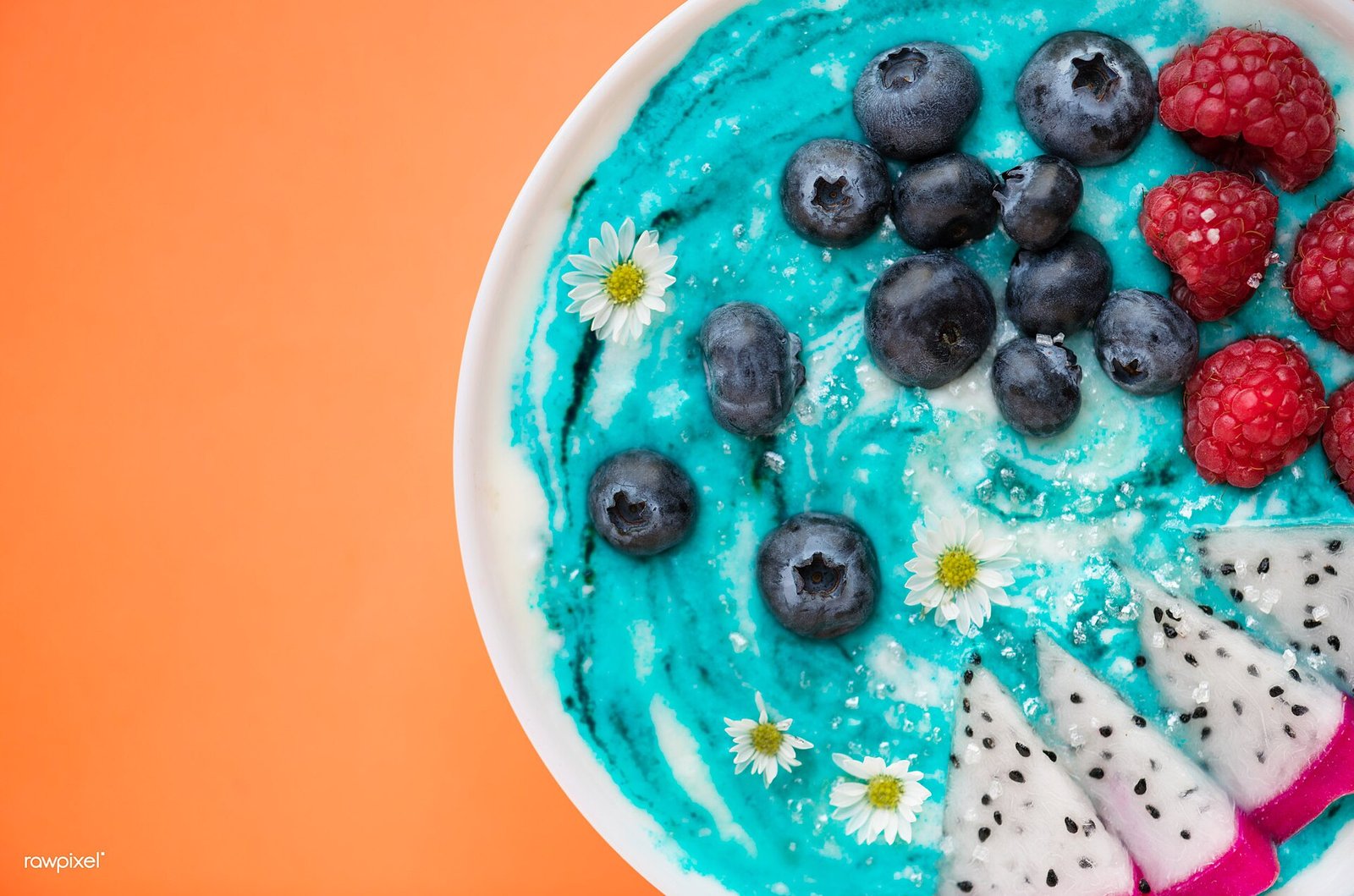 Endometriosis diet: smoothie bowl topped with blueberries, raspberries, and fruit