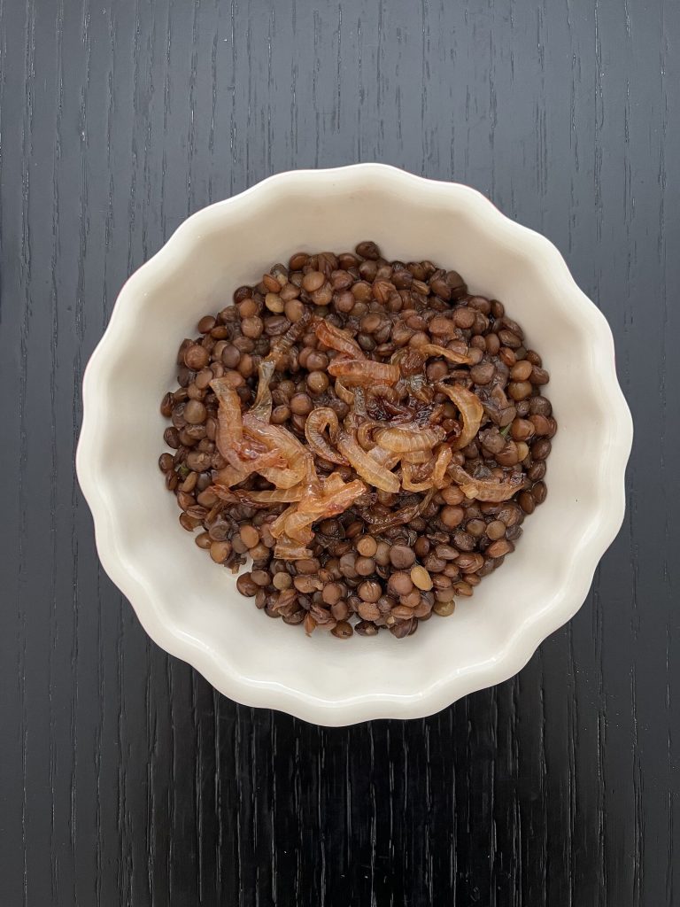 Cooked lentils with caramelized onions, a plant iron staple for iron-deficiency anemia diet support