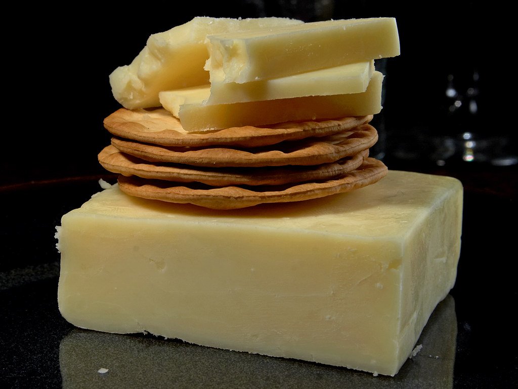 Hard cheddar cheese, a lower-lactose cheese choice for lactose intolerance