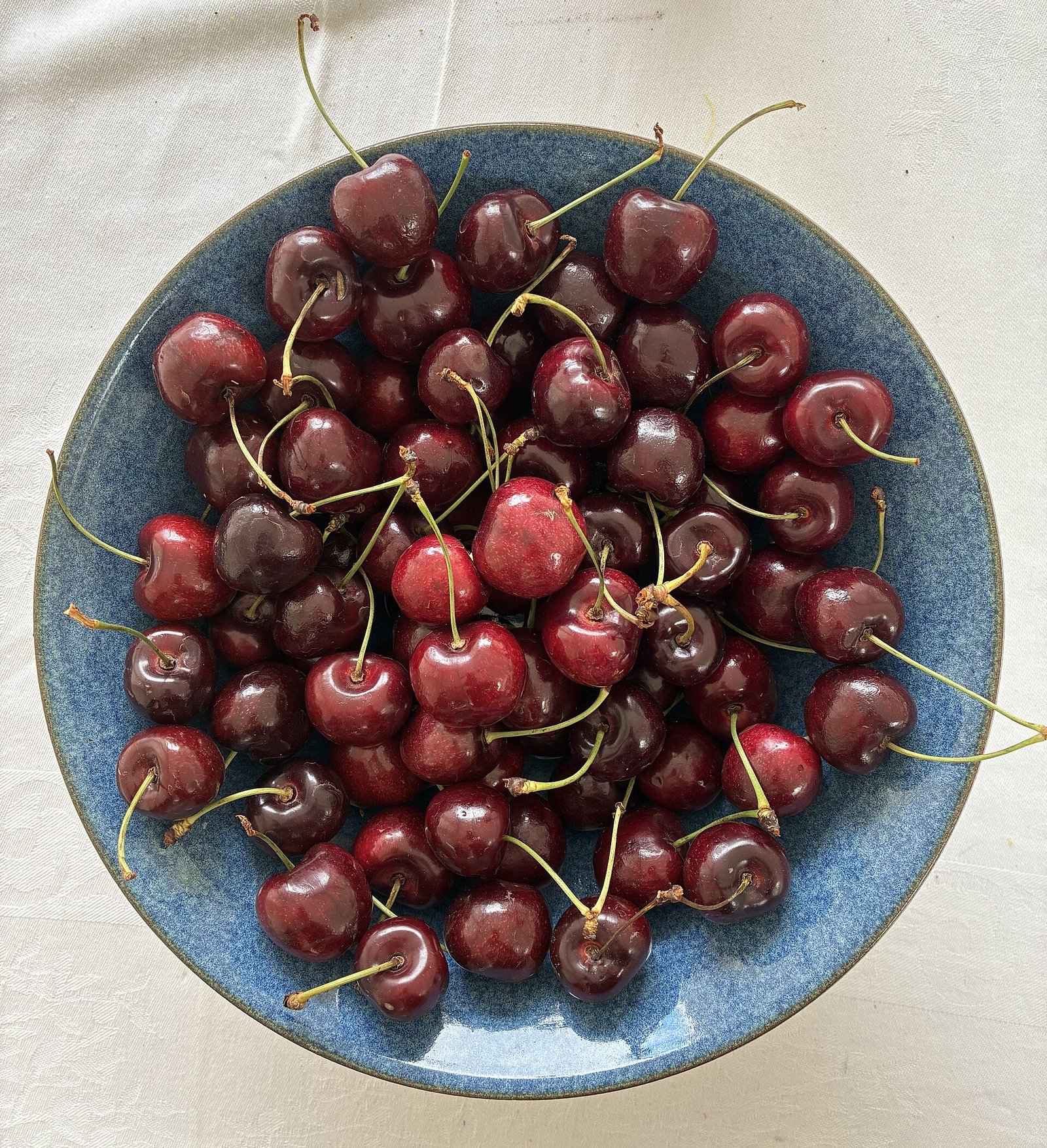 Bowl of fresh cherries, a colorful fruit often included in an osteoarthritis-friendly Mediterranean-style diet