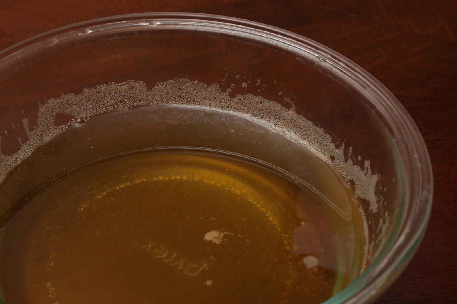 Bowl of clear vegetable broth for fluids in a pancreatitis diet