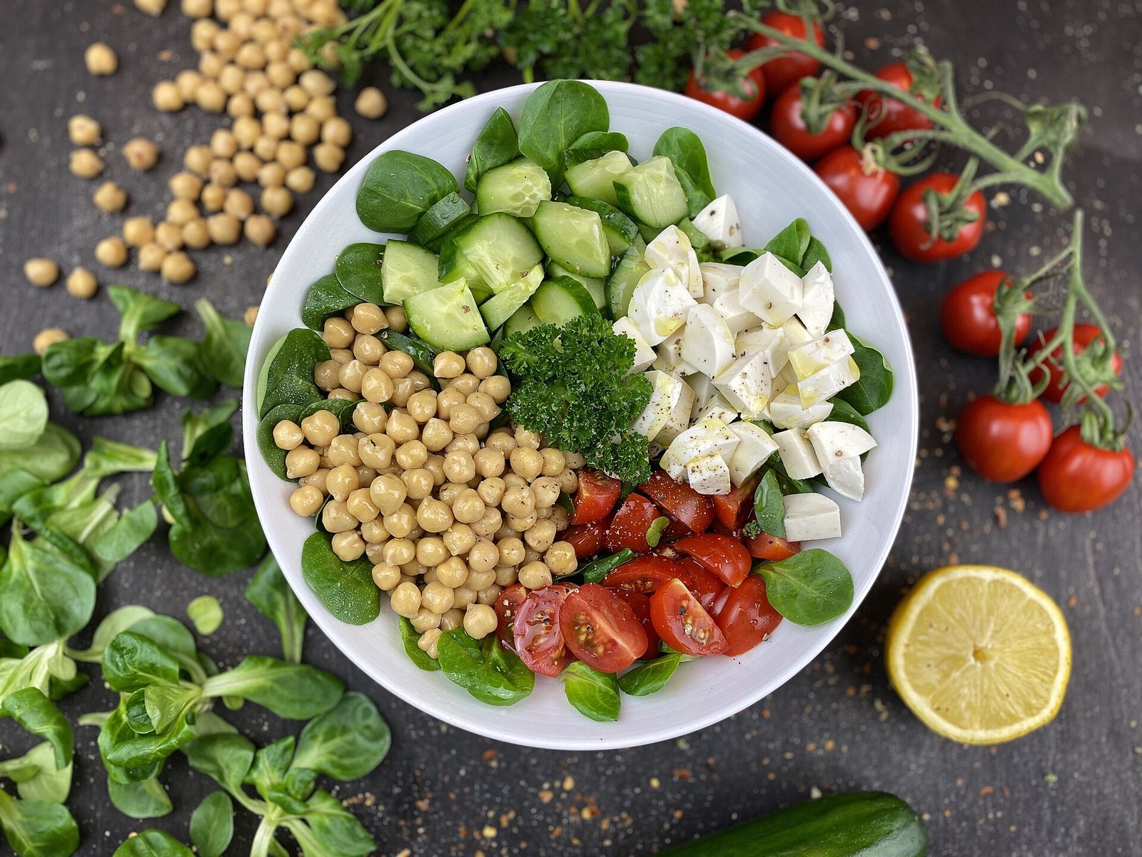 Colorful chickpea salad with vegetables, a complex carbohydrate meal for a PMS diet
