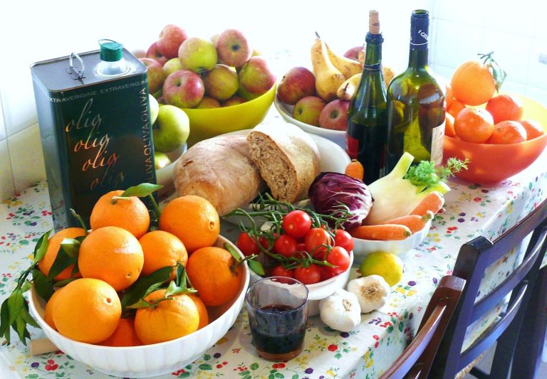 Mediterranean diet spread of fruit, vegetables, bread and olive oil for a rheumatoid arthritis diet