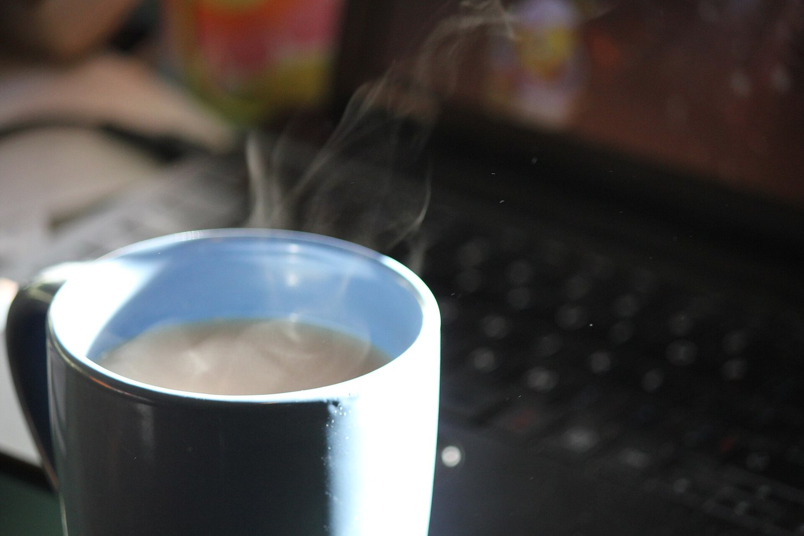 Steaming cup of hot tea; hot drinks are a common rosacea flushing trigger