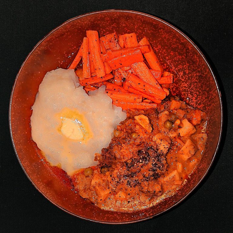 Roasted carrots and vegetables with olive oil, a plant-forward sciatica diet plate